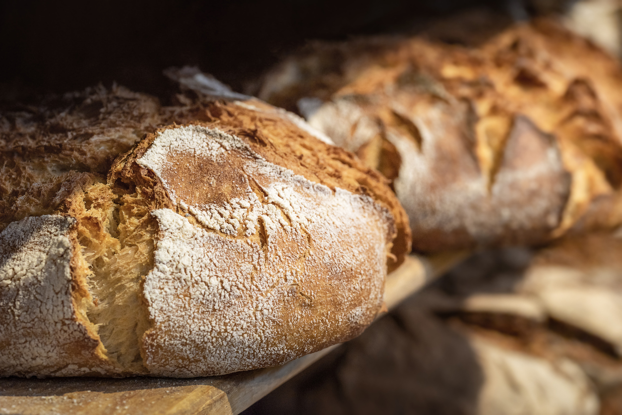 Sourdough bread on wooden shelves