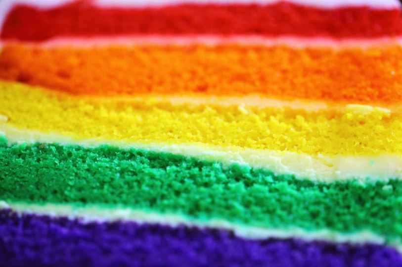No toppings just vibrant colors and the luscious taste of rainbow cheesecake.