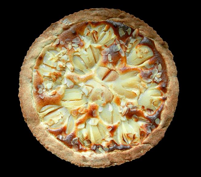 Homemade pear pie with almond toppings.